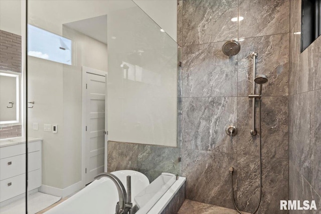 2004 Grants Pond, Chatham, IL 62629 - bathroom featuring a freestanding bath, tiled shower, and vanity