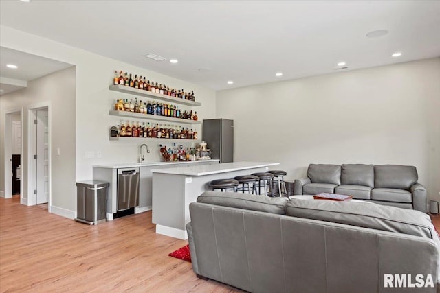 2004 Grants Pond, Chatham, IL 62629 - living room featuring wet bar, light wood-style flooring, and recessed lighting