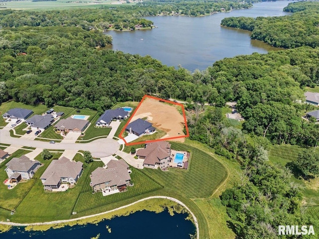 2004 Grants Pond, Chatham, IL 62629 - aerial view of property and surrounding area featuring a large body of water, property boundaries highlighted, and nearby suburban area