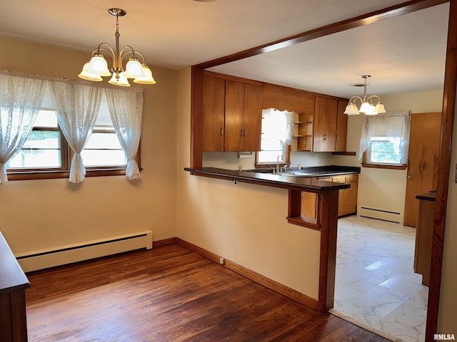 161 Hawkinson Ave, Galesburg, IL 61401 - kitchen featuring a baseboard radiator, a chandelier, brown cabinets, and dark countertops