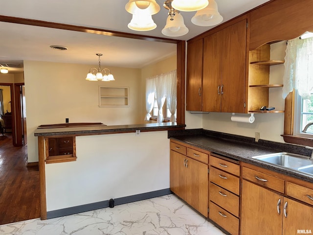 161 Hawkinson Ave, Galesburg, IL 61401 - kitchen featuring open shelves, dark countertops, a chandelier, and brown cabinetry