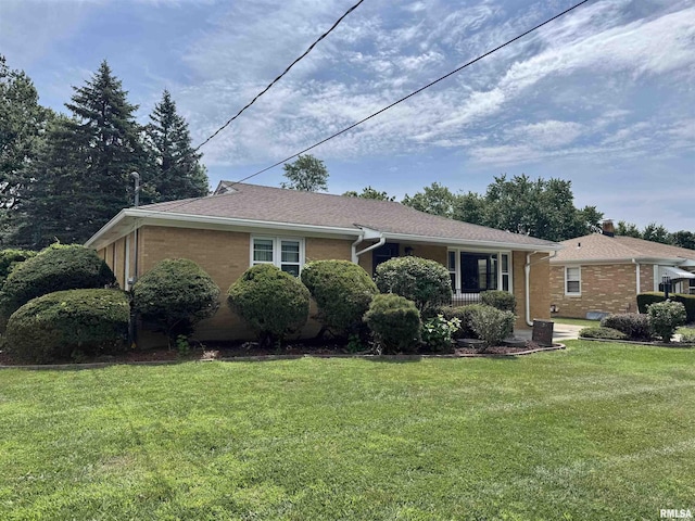 161 Hawkinson Ave, Galesburg, IL 61401 - ranch-style house featuring a front yard and brick siding