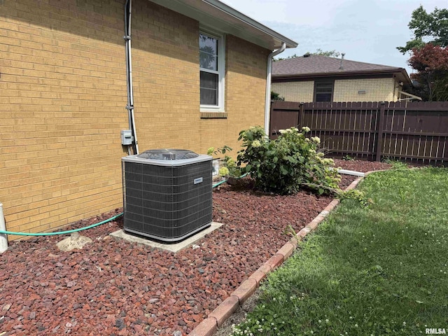 161 Hawkinson Ave, Galesburg, IL 61401 - exterior view of a central air condition unit and brick siding