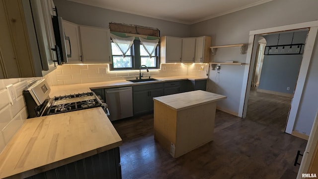927 Sycamore St, Quincy, IL 62301 - kitchen with stainless steel dishwasher, tasteful backsplash, a center island, gas stove, and crown molding