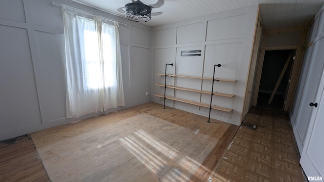 927 Sycamore St, Quincy, IL 62301 - unfurnished bedroom featuring a decorative wall and wood finished floors