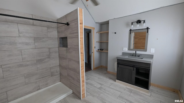 927 Sycamore St, Quincy, IL 62301 - bathroom featuring vanity, a tile shower, lofted ceiling, and a ceiling fan