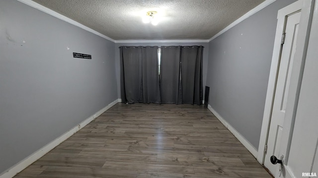 927 Sycamore St, Quincy, IL 62301 - unfurnished room with a textured ceiling, crown molding, and wood finished floors