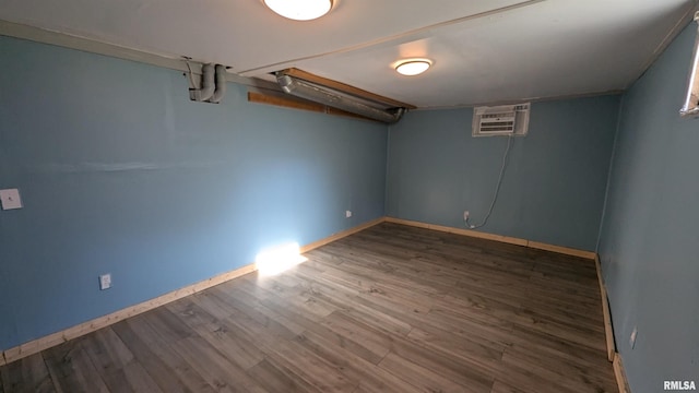 927 Sycamore St, Quincy, IL 62301 - finished basement with an AC wall unit and wood finished floors