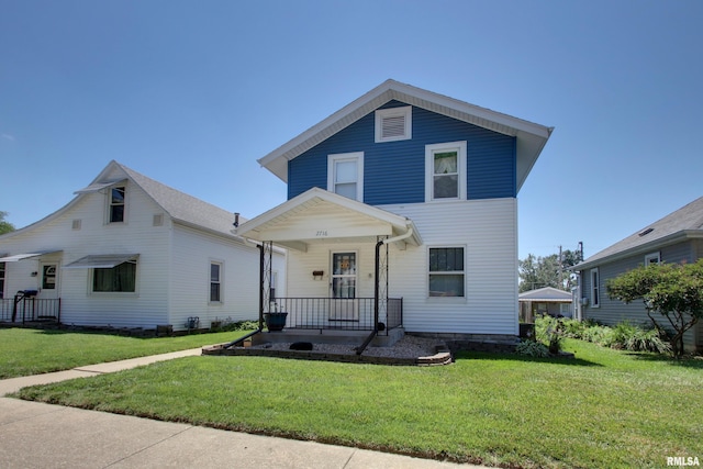 2716 Elm St, Quincy, IL 62301 - view of front facade featuring a porch and a front yard