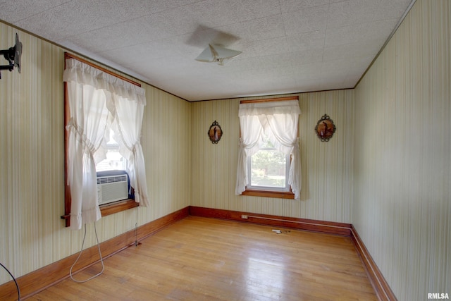 2716 Elm St, Quincy, IL 62301 - unfurnished room with wood finished floors and cooling unit