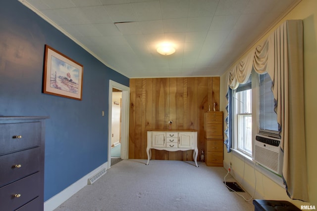 2716 Elm St, Quincy, IL 62301 - bedroom with ornamental molding, multiple windows, carpet floors, and wooden walls