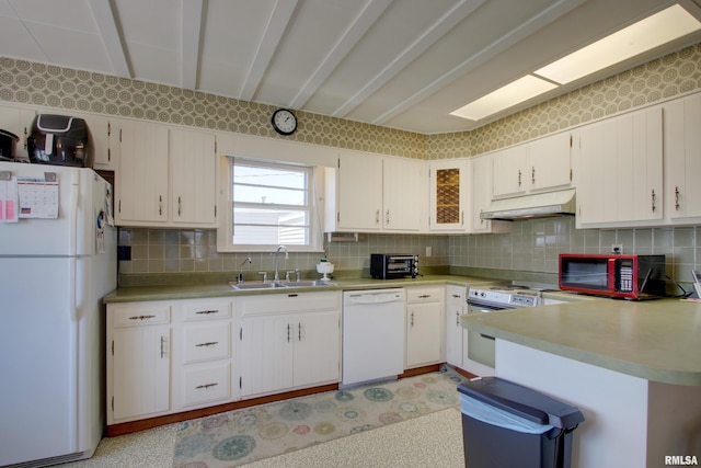 2716 Elm St, Quincy, IL 62301 - kitchen featuring white appliances, under cabinet range hood, backsplash, light countertops, and light flooring