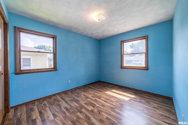 2700 Northridge Dr, Quincy, IL 62301 - empty room with dark wood finished floors and baseboards