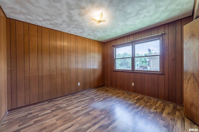 2700 Northridge Dr, Quincy, IL 62301 - empty room with wood finished floors and wooden walls