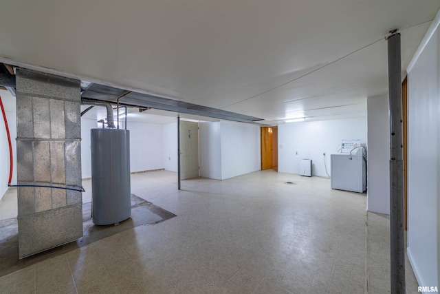 2700 Northridge Dr, Quincy, IL 62301 - finished below grade area featuring water heater, washer / dryer, tile patterned floors, and heating unit