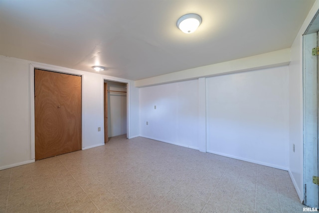 2700 Northridge Dr, Quincy, IL 62301 - unfurnished bedroom featuring multiple closets and baseboards