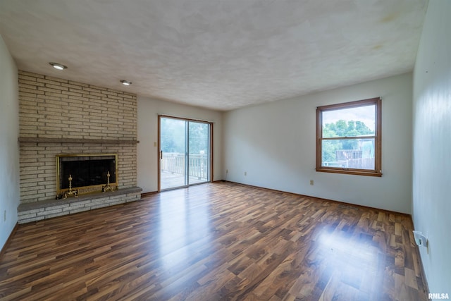 2700 Northridge Dr, Quincy, IL 62301 - unfurnished living room featuring wood finished floors and a fireplace