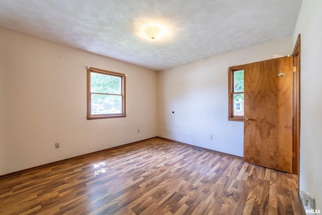 2700 Northridge Dr, Quincy, IL 62301 - unfurnished room with wood finished floors and baseboards