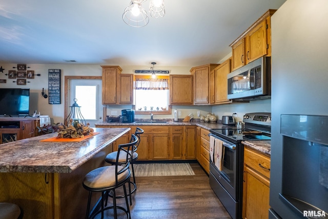 23490 E Maple Rd, Bluford, IL 62814 - kitchen featuring freestanding refrigerator, stainless steel microwave, electric range oven, and brown cabinetry