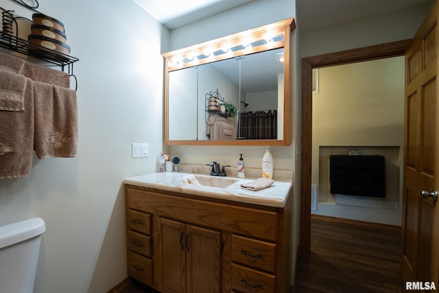 23490 E Maple Rd, Bluford, IL 62814 - full bathroom featuring vanity, wood finished floors, and heating unit