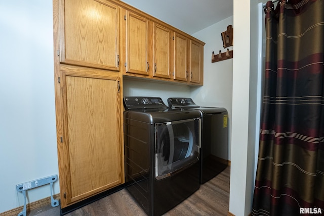 23490 E Maple Rd, Bluford, IL 62814 - laundry room with independent washer and dryer, dark wood-style flooring, and cabinet space
