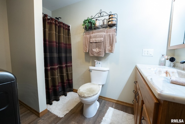23490 E Maple Rd, Bluford, IL 62814 - full bath with wood finished floors, vanity, and a shower with curtain