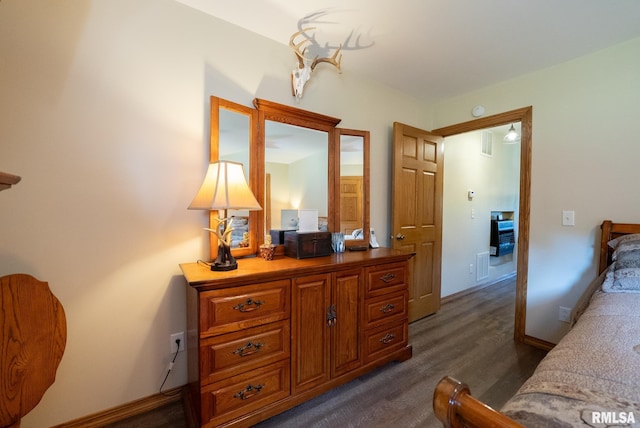 23490 E Maple Rd, Bluford, IL 62814 - bedroom with dark wood-style floors and baseboards