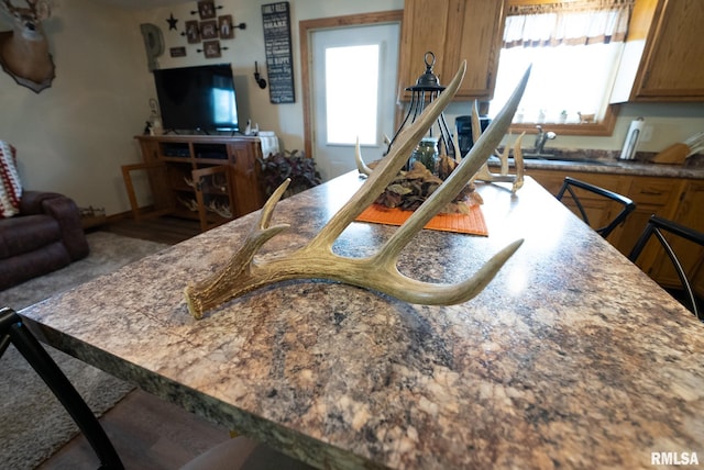 23490 E Maple Rd, Bluford, IL 62814 - kitchen featuring brown cabinetry and open floor plan