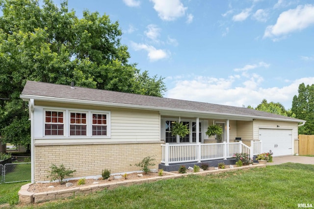 1717 Melview Rd, Quincy, IL 62305 - single story home with covered porch, a garage, brick siding, and driveway
