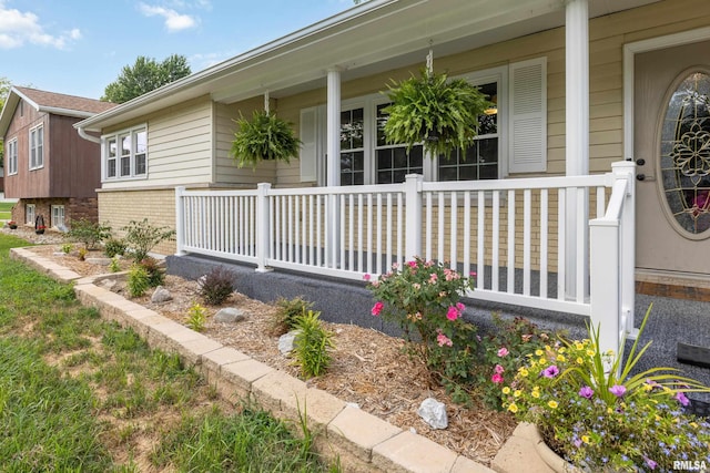 1717 Melview Rd, Quincy, IL 62305 - view of exterior entry featuring a porch and brick siding