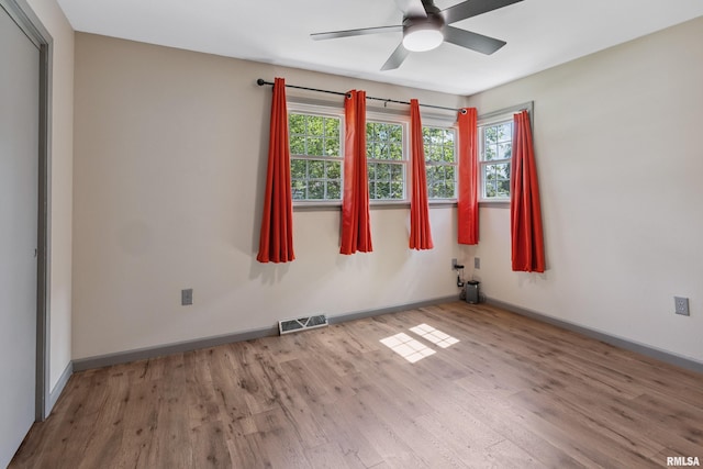 1717 Melview Rd, Quincy, IL 62305 - spare room featuring wood finished floors, plenty of natural light, and a ceiling fan