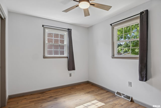 1717 Melview Rd, Quincy, IL 62305 - unfurnished room featuring a ceiling fan and wood finished floors