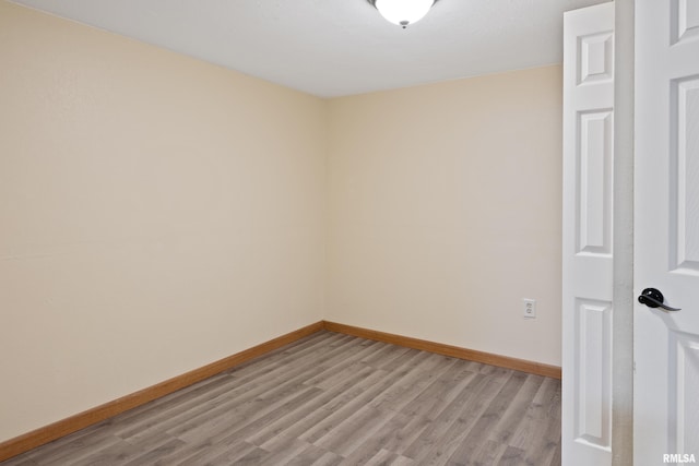 1717 Melview Rd, Quincy, IL 62305 - unfurnished room featuring light wood finished floors and baseboards