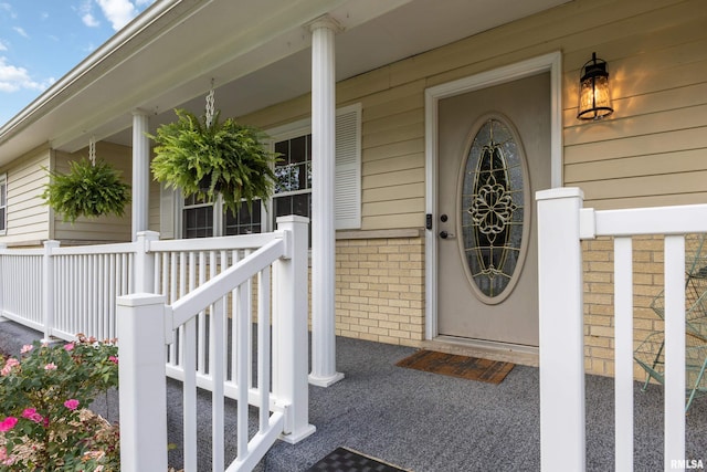1717 Melview Rd, Quincy, IL 62305 - property entrance featuring covered porch and brick siding