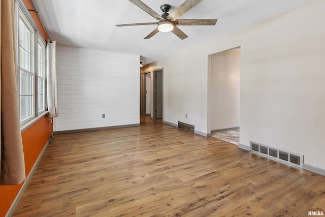 1717 Melview Rd, Quincy, IL 62305 - unfurnished room featuring a ceiling fan and wood finished floors