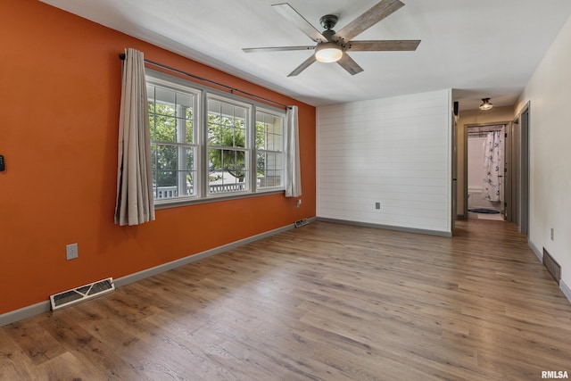 1717 Melview Rd, Quincy, IL 62305 - unfurnished room featuring ceiling fan and wood finished floors