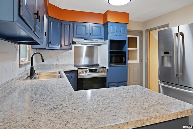 1717 Melview Rd, Quincy, IL 62305 - kitchen featuring stainless steel appliances, under cabinet range hood, blue cabinets, light countertops, and a peninsula