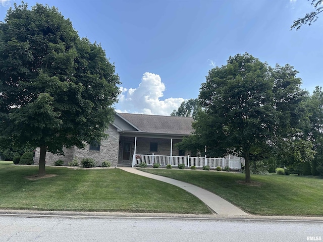4004 Abbey Ridge St, Quincy, IL 62305 - view of front of home with a porch, a front lawn, brick siding, and roof with shingles
