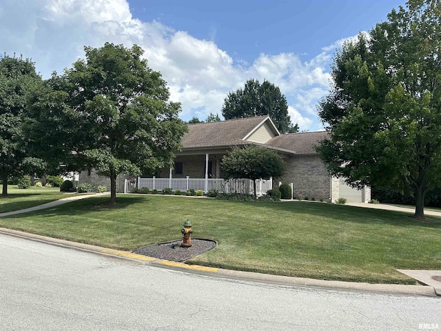 4004 Abbey Ridge St, Quincy, IL 62305 - view of front of house with a front yard, roof with shingles, brick siding, and driveway