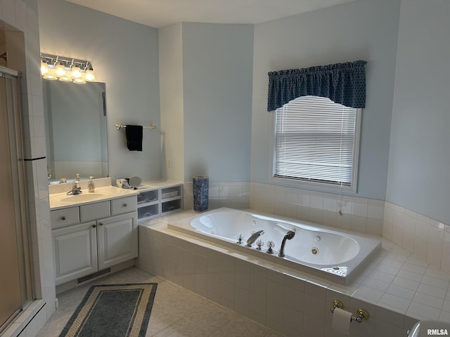 4004 Abbey Ridge St, Quincy, IL 62305 - full bath featuring a jetted tub, vanity, a shower stall, and tile patterned floors