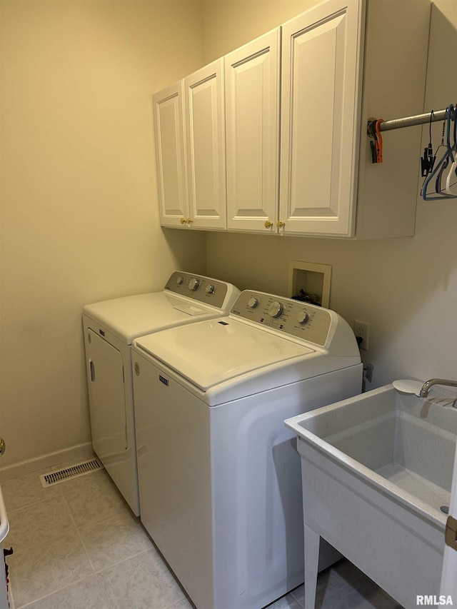 4004 Abbey Ridge St, Quincy, IL 62305 - laundry area featuring washing machine and dryer and cabinet space