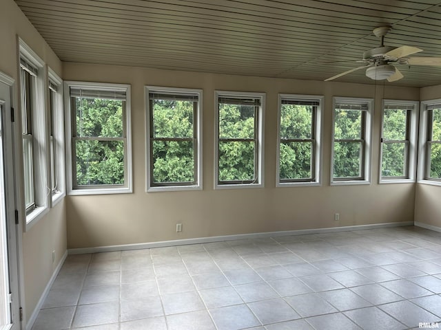 4004 Abbey Ridge St, Quincy, IL 62305 - unfurnished sunroom featuring tile patterned flooring and baseboards