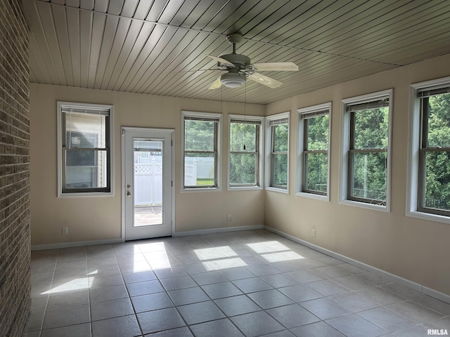 4004 Abbey Ridge St, Quincy, IL 62305 - unfurnished sunroom featuring tile patterned flooring and brick wall