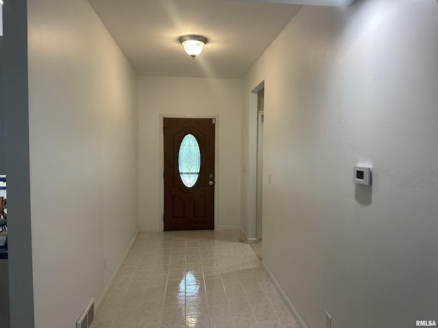 4004 Abbey Ridge St, Quincy, IL 62305 - doorway with baseboards and light tile patterned floors