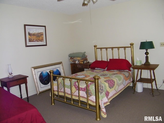 bedroom featuring ceiling fan and dark colored carpet