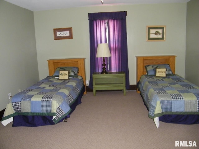 bedroom with light colored carpet