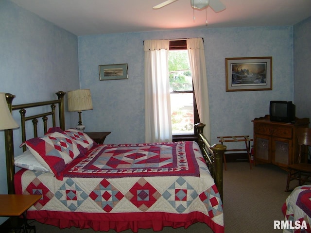 carpeted bedroom featuring ceiling fan