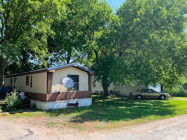 view of home's exterior featuring a lawn