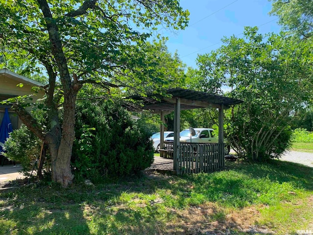 view of yard featuring a pergola and a wooden deck