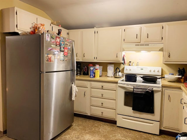 kitchen featuring white cabinetry, electric stove, lofted ceiling, and stainless steel fridge